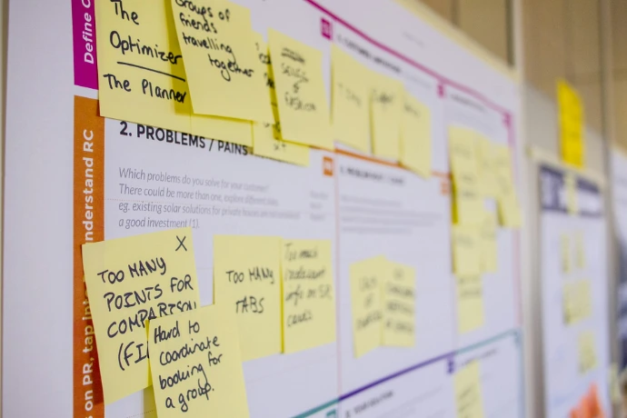 organizational sticky notes glued on board 